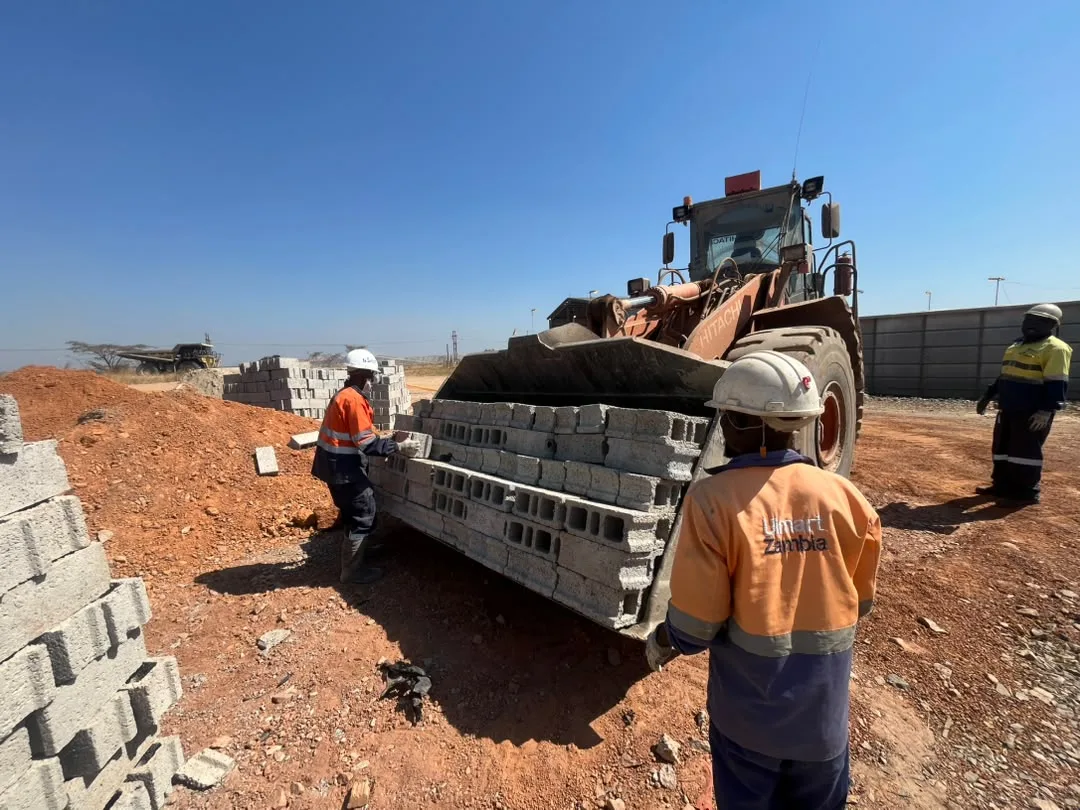 Material delivery to site by loader